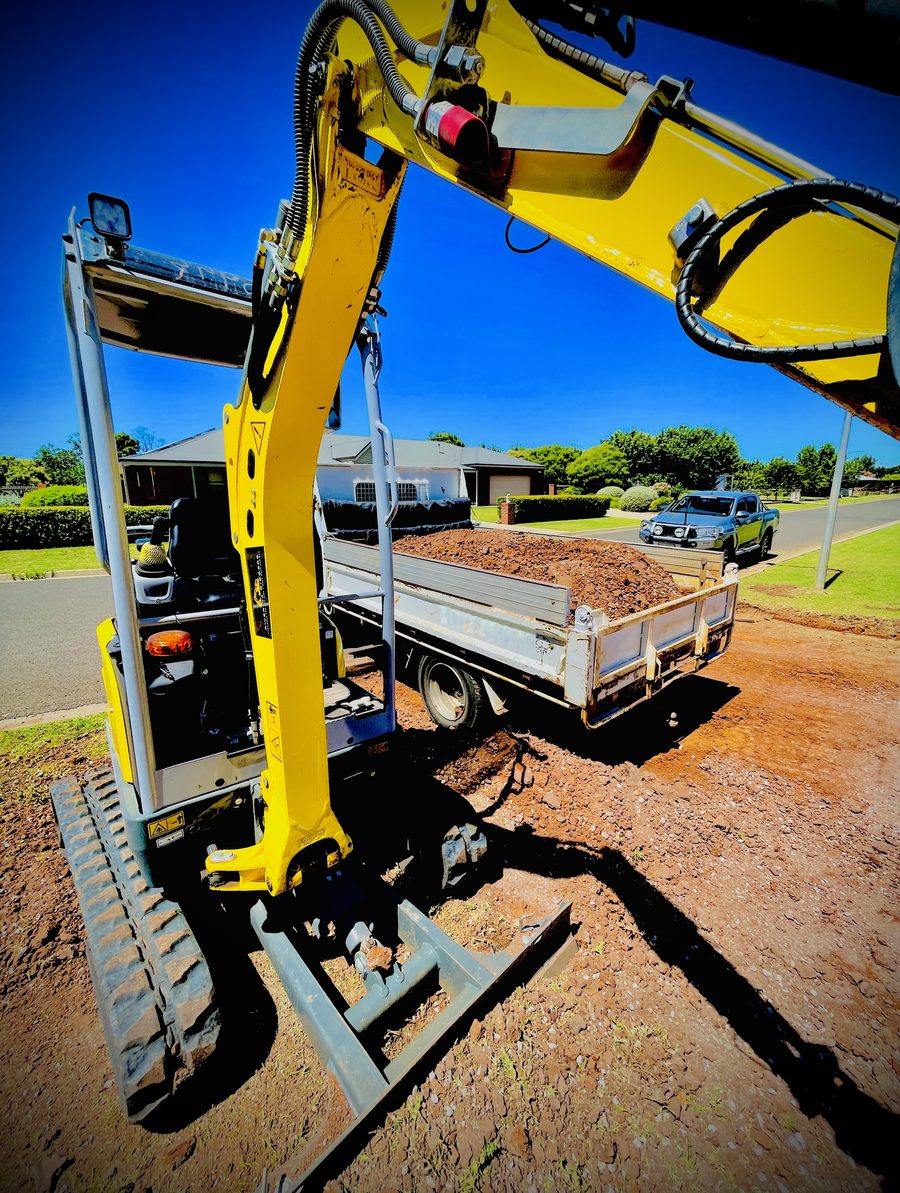 Riverina Diggers excavator loading spoil into the tipper truck on a residential job in Griffith